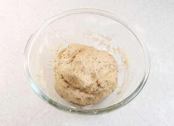Freshly kneaded bread dough in a glass bowl Stock photo © sarahdoow
