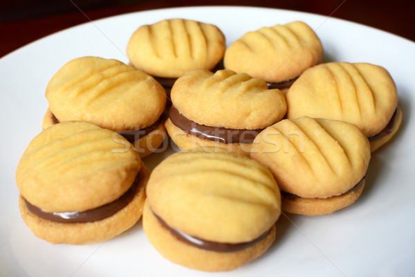 Plate of shortbread biscuits with chocolate filling Stock photo © sarahdoow