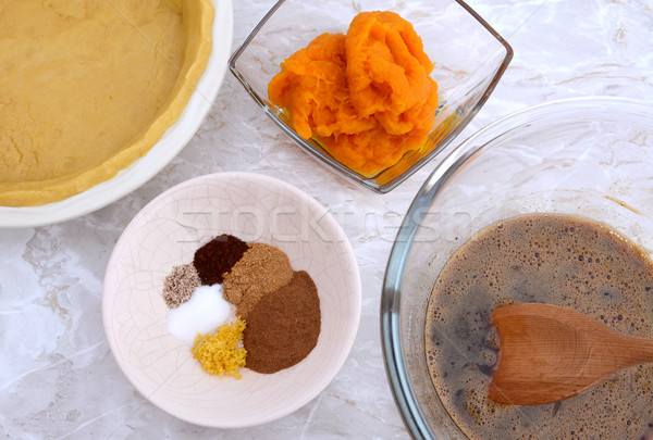 Making pumpkin pie - pastry crust, pumpkin, spices and filling Stock photo © sarahdoow