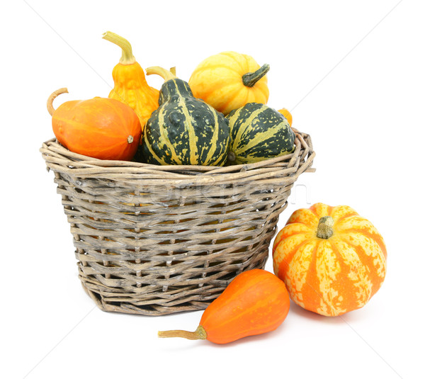 Green, orange and yellow ornamental gourds in a basket Stock photo © sarahdoow