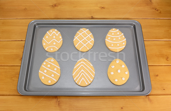 Frosted Easter egg cookies on a baking tray Stock photo © sarahdoow