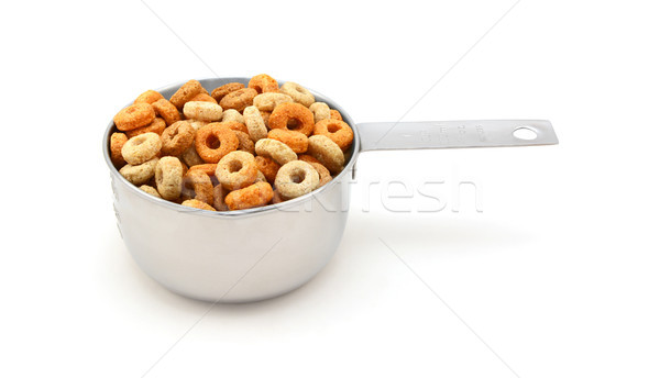 Multigrain hoops breakfast cereal in a measuring cup Stock photo © sarahdoow