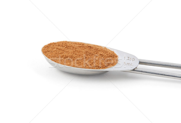 Ground cinnamon measured in a metal teaspoon Stock photo © sarahdoow