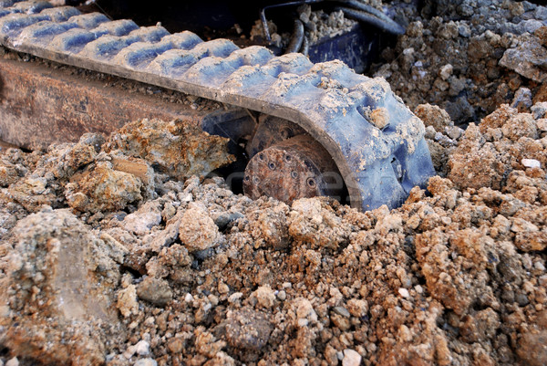 Digger tracks running through soil and stones Stock photo © sarahdoow