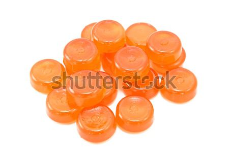 Pile of orange boiled sweets Stock photo © sarahdoow