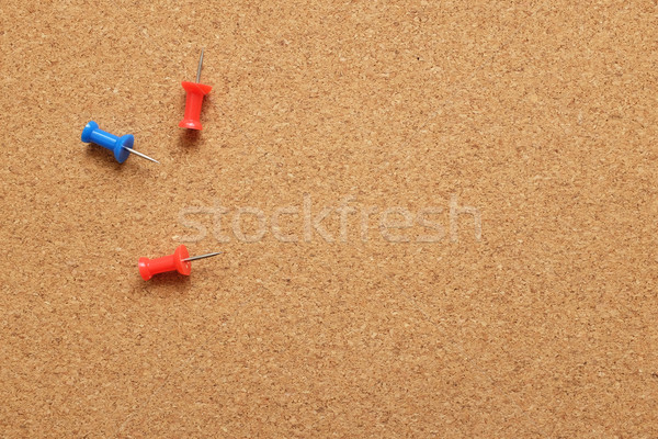 Stock photo: Three push pins on a cork noticeboard