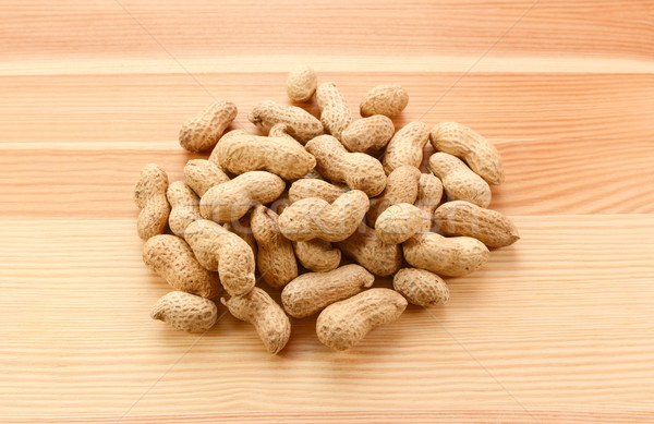 Heap of monkey nuts, peanuts or groundnuts in shells Stock photo © sarahdoow