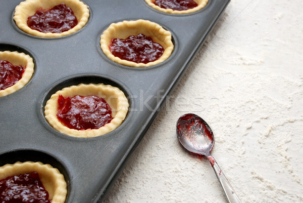 Filled, uncooked jam tarts in a tin Stock photo © sarahdoow