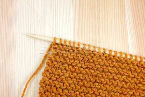 Garter stitch in orange yarn on a knitting needle Stock photo © sarahdoow