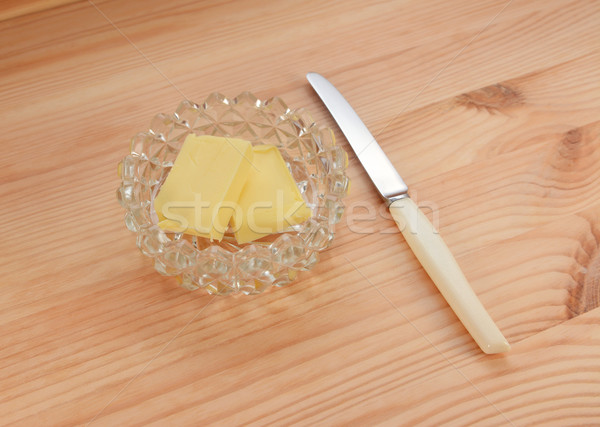 Butter in a glass dish with a small knife for spreading Stock photo © sarahdoow