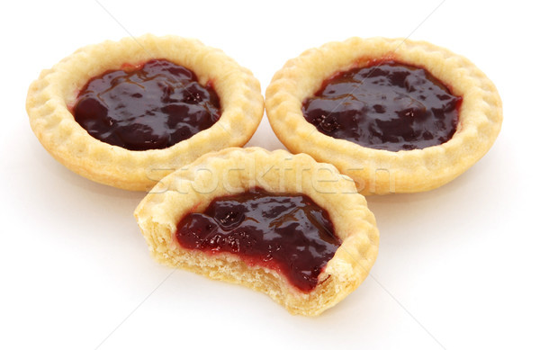 Three jam tarts, one with a bite taken Stock photo © sarahdoow