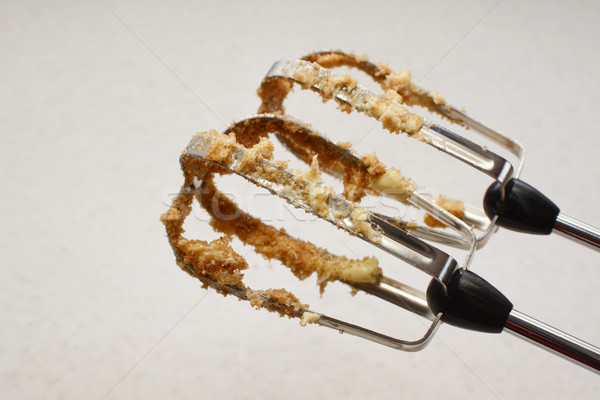 Stock photo: Food mixer beaters covered in butter and sugar
