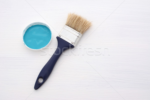 Clean paintbrush and blue paint on white board Stock photo © sarahdoow