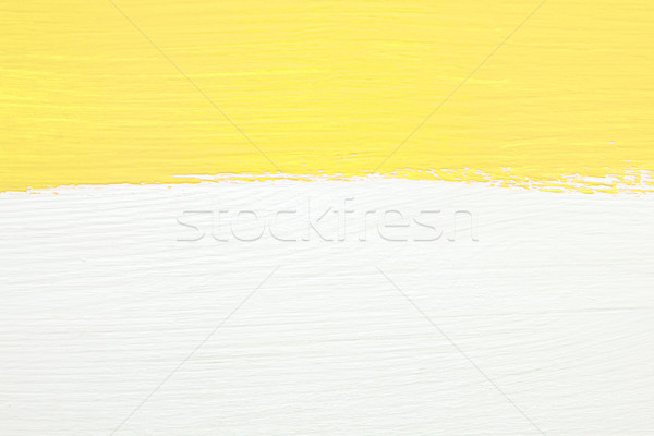 Stripe of yellow paint over white wooden background Stock photo © sarahdoow