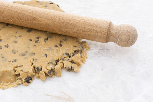 Wooden rolling pin on chocolate chip shortbread dough Stock photo © sarahdoow