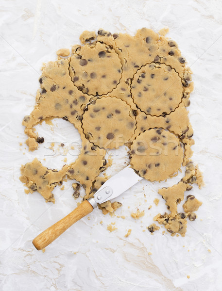 Circles in chocolate chip cookie dough with palette knife Stock photo © sarahdoow