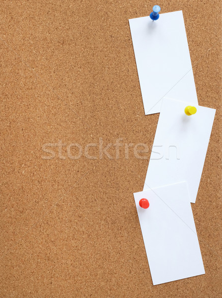 Cork noticeboard with three white cards pinned vertically Stock photo © sarahdoow