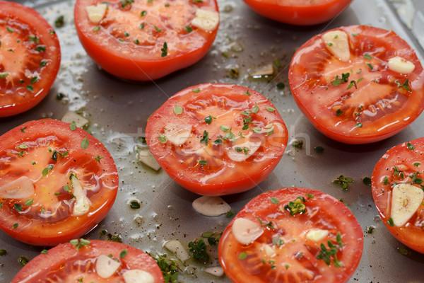 Tomato halves for ready roasting, with garlic, thyme and oil Stock photo © sarahdoow