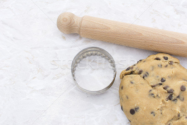 Chocolate chip cookie dough with rolling pin and cookie cutter  Stock photo © sarahdoow