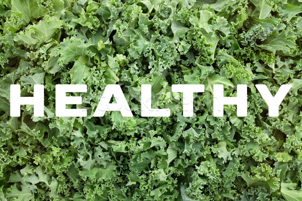 HEALTHY text over shredded kale leaves background Stock photo © sarahdoow