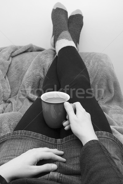 Woman dressed warmly, relaxing with a hot drink Stock photo © sarahdoow