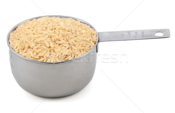 Long grain brown rice in a measuring cup Stock photo © sarahdoow