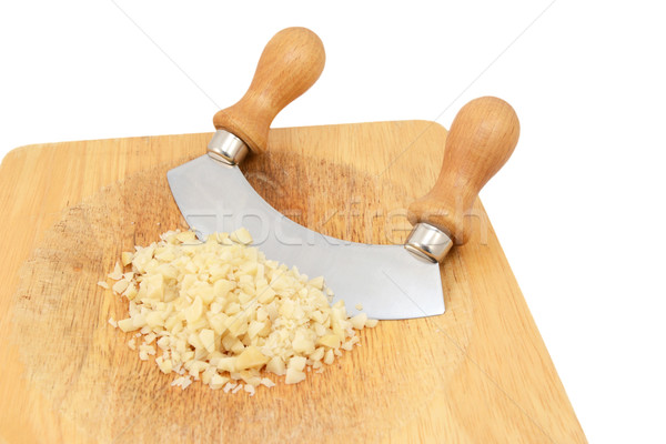 Picado nueces cuchillo tabla de cortar aislado Foto stock © sarahdoow