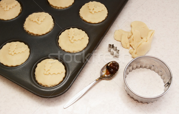 Uncooked mince pies in a bun tin Stock photo © sarahdoow