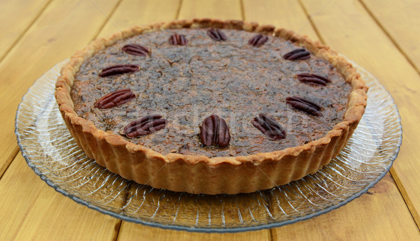 Freshly baked pecan pie on a glass plate Stock photo © sarahdoow