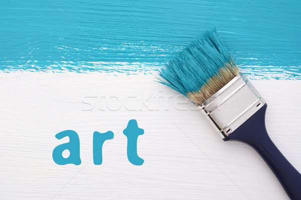 Stripe of turquoise paint, paintbrush and the word ART Stock photo © sarahdoow