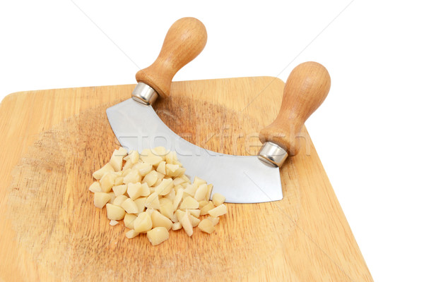Coarsely chopped macadamia nuts with a rocking knife Stock photo © sarahdoow