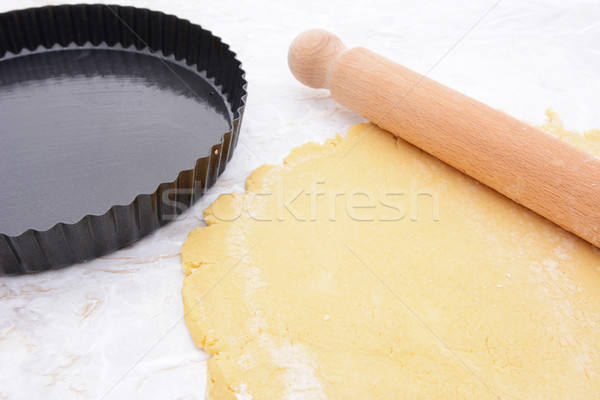 Baking tin next to shortcrust pastry and rolling pin Stock photo © sarahdoow