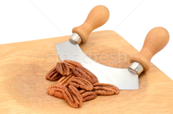 Stock photo: Pecan nuts with a rocking knife