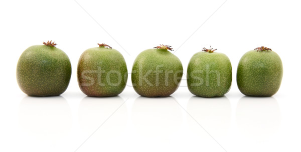 Stock photo: Line of five kiwi berries