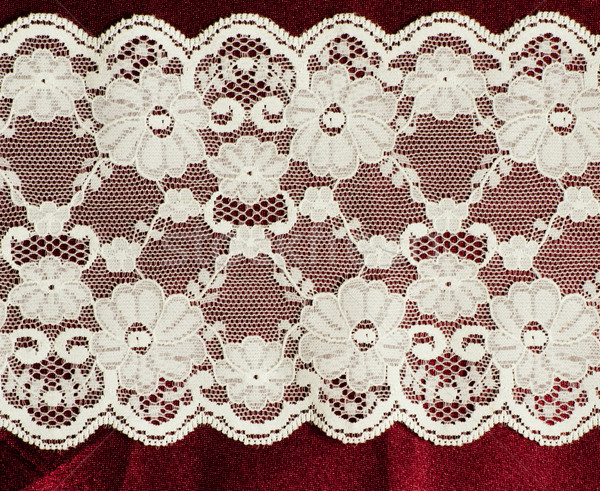 lace on the red satin fabric Stock photo © Sarkao