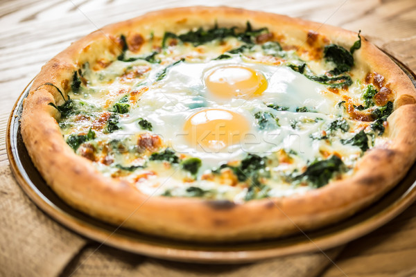 Margarita pizza with arugula and egg Stock photo © sarymsakov