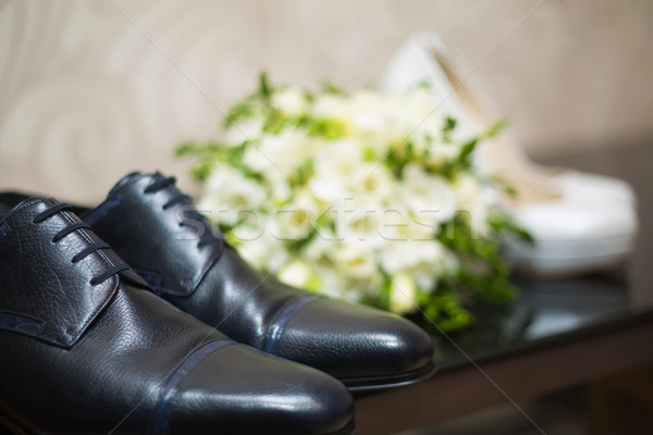 Bride's and groom's shoes on parquet. Stock photo © sarymsakov