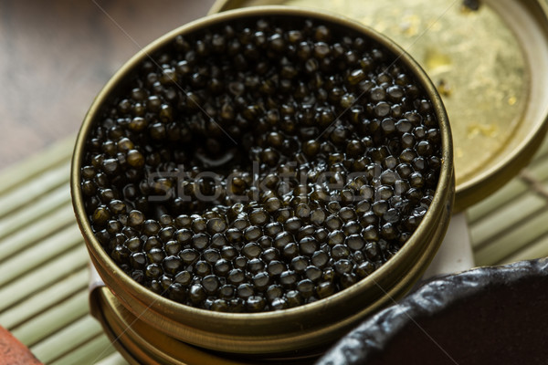 Black caviar in small round metal tin  Stock photo © sarymsakov