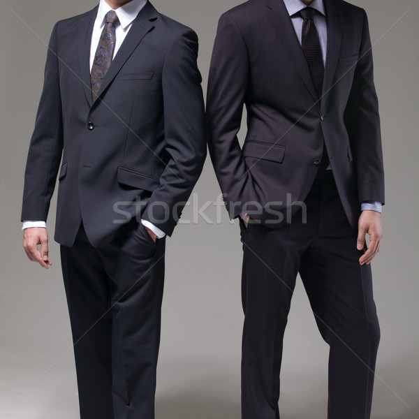 Due uomini elegante suit buio moda sfondo Foto d'archivio © sarymsakov