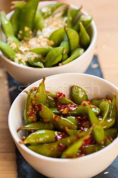 Green string beans chinese dish with spices Stock photo © sarymsakov