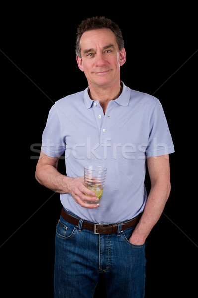 Handsome Smiling Middle Age Man Holding Drink Stock photo © scheriton