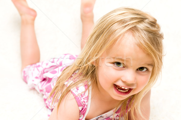 Portrait of Beautiful Toddler Girl Lying Down Stock photo © scheriton