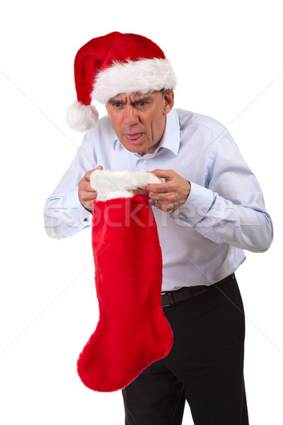 Business Man in Santa Hat Throwing Up into Christmas Stocking Stock photo © scheriton