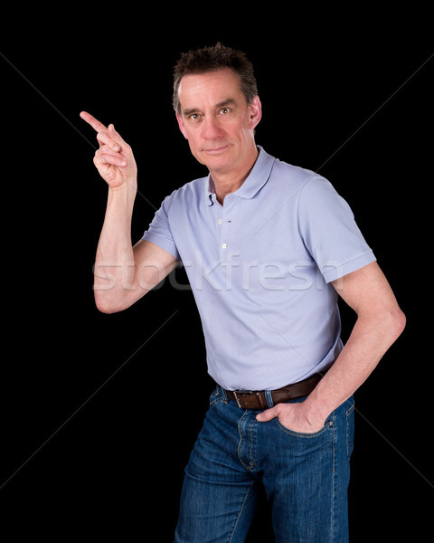 Handsome Middle Age Man Pointing At Something Stock photo © scheriton