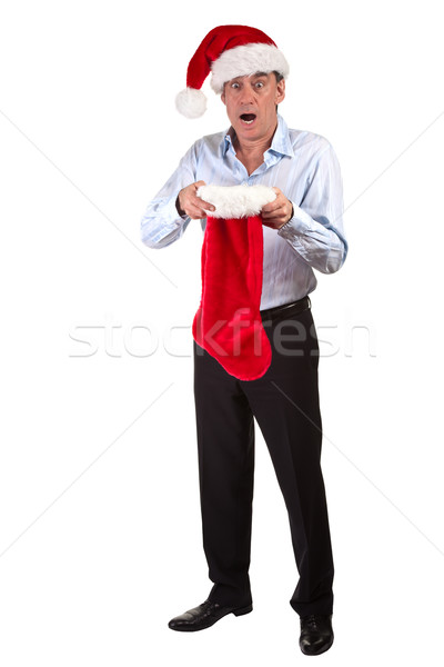 Business Man in Santa Hat shocked at contents of Christmas Stocking Stock photo © scheriton
