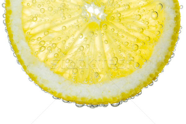 Lemon Slice in Clear Fizzy Water Bubble Background Stock photo © scheriton