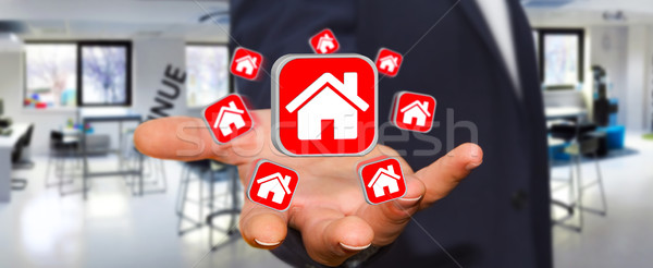 Businessman using modern application to rent a flat Stock photo © sdecoret
