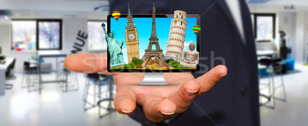 Man travelling the world with his computer Stock photo © sdecoret
