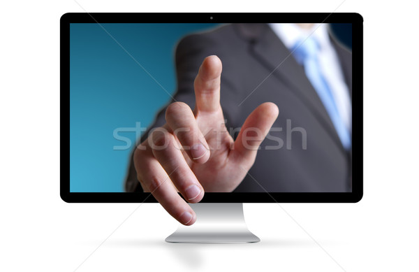 Businessman escaping from computer Stock photo © sdecoret
