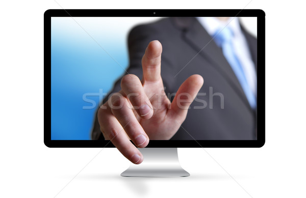 Businessman escaping from computer Stock photo © sdecoret